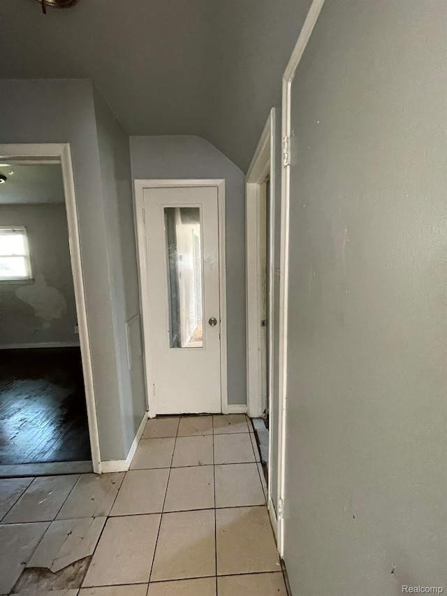 20569 Evergreen Rd, Detroit, MI 48219 - hall featuring lofted ceiling and light tile patterned floors