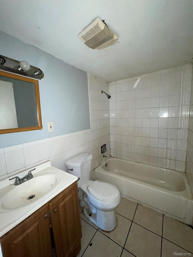 20569 Evergreen Rd, Detroit, MI 48219 - bathroom with tile patterned floors, tile walls, vanity, bathing tub / shower combination, and wainscoting
