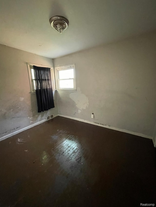 20569 Evergreen Rd, Detroit, MI 48219 - unfurnished room featuring baseboards and hardwood / wood-style floors
