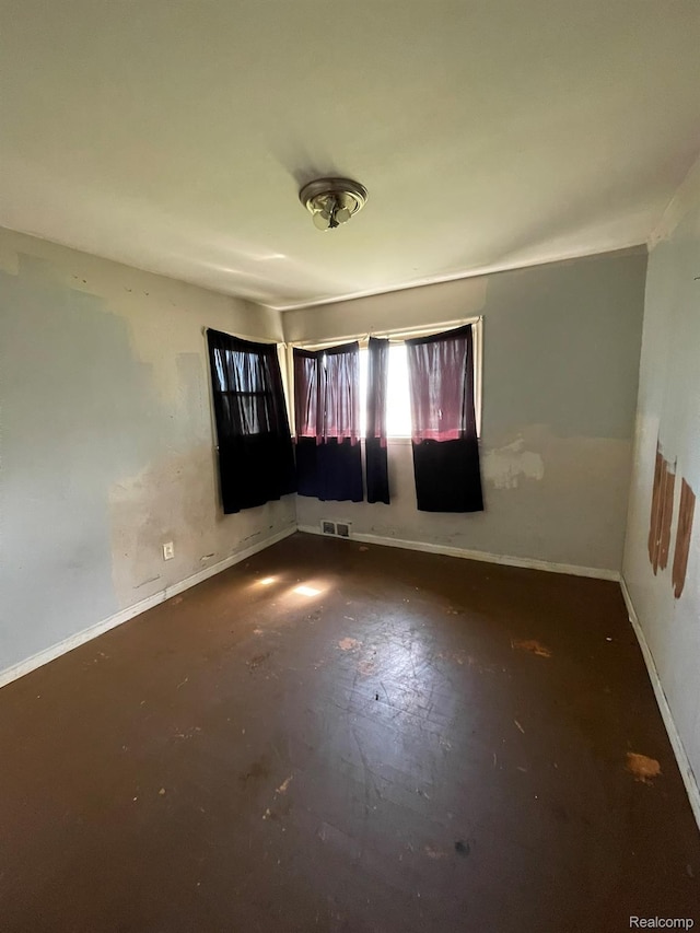 20569 Evergreen Rd, Detroit, MI 48219 - spare room with baseboards and concrete flooring