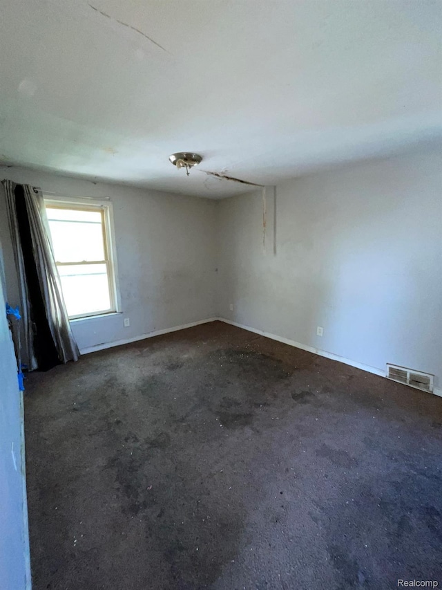 20569 Evergreen Rd, Detroit, MI 48219 - empty room with concrete flooring and baseboards