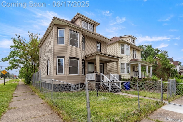 4266 Seminole St, Dearborn, MI 48214 - american foursquare style home featuring covered porch and a fenced front yard