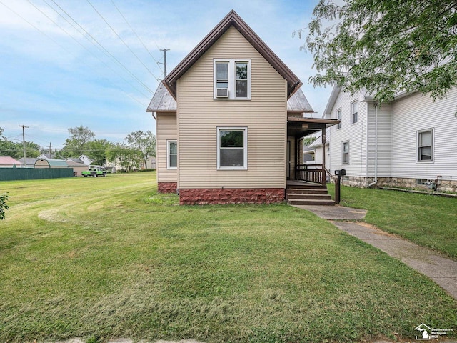 606 E 3rd St, Monroe, MI 48161 - view of front of property featuring a front lawn and a porch