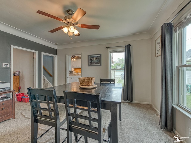 606 E 3rd St, Monroe, MI 48161 - dining space featuring light carpet, healthy amount of natural light, and a ceiling fan