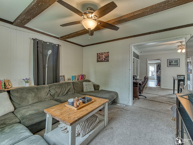 606 E 3rd St, Monroe, MI 48161 - living room with ceiling fan, light carpet, beamed ceiling, crown molding, and wooden walls