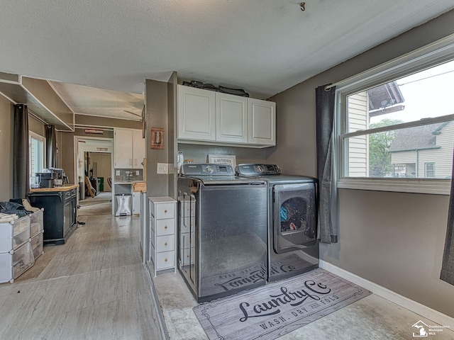 606 E 3rd St, Monroe, MI 48161 - laundry area with cabinet space and washer and clothes dryer