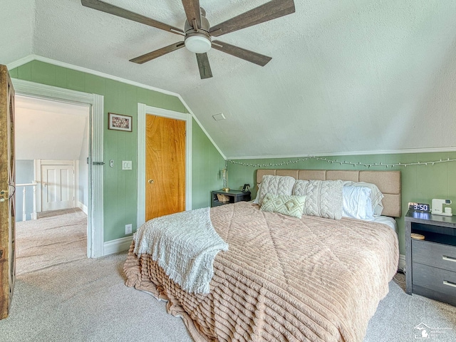 606 E 3rd St, Monroe, MI 48161 - carpeted bedroom with vaulted ceiling, a textured ceiling, ornamental molding, and a ceiling fan