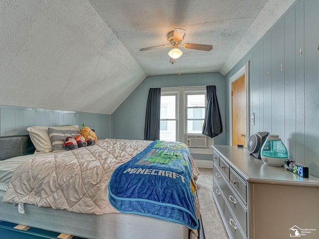 606 E 3rd St, Monroe, MI 48161 - bedroom with a textured ceiling, vaulted ceiling, light colored carpet, ceiling fan, and wood walls