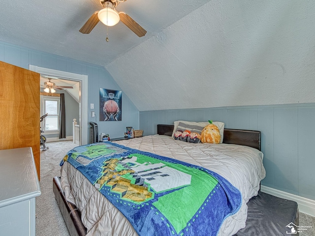 606 E 3rd St, Monroe, MI 48161 - bedroom with carpet, vaulted ceiling, a ceiling fan, and a textured ceiling