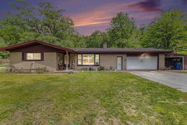 116 E Beech St, Fruitport, MI 49415 - ranch-style house with brick siding, an attached garage, a lawn, concrete driveway, and a chimney