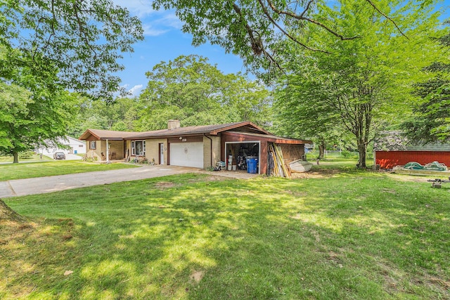 116 E Beech St, Fruitport, MI 49415 - ranch-style home featuring a front yard, a chimney, asphalt driveway, and an attached garage