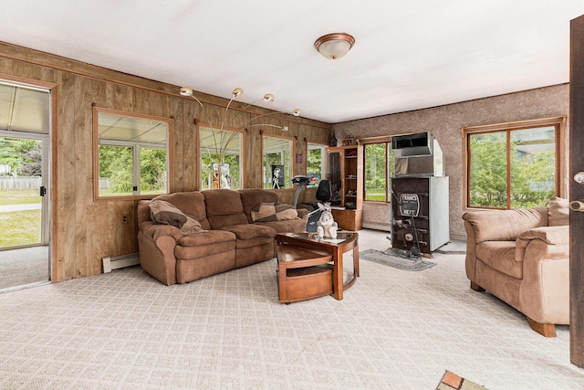 116 E Beech St, Fruitport, MI 49415 - carpeted living room with a baseboard radiator and wooden walls