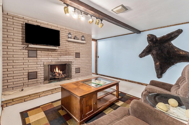 116 E Beech St, Fruitport, MI 49415 - living area with a fireplace, beam ceiling, and track lighting