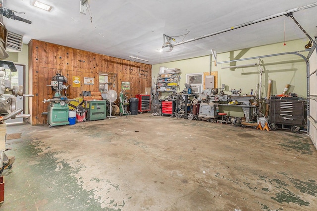 116 E Beech St, Fruitport, MI 49415 - garage with a workshop area and wooden walls