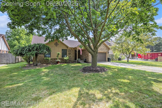 33550 24 Mile Rd, Chesterfield, MI 48047 - view of property hidden behind natural elements featuring concrete driveway, brick siding, and a garage