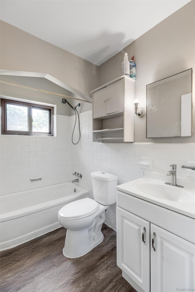 12892 Asbury Park, Detroit, MI 48227 - bathroom featuring tile walls, vanity, wood finished floors, and shower / washtub combination