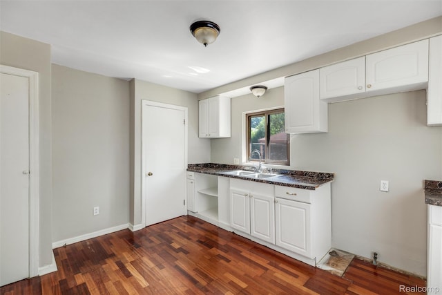 12892 Asbury Park, Detroit, MI 48227 - kitchen featuring white cabinetry, dark wood finished floors, open shelves, and dark stone countertops