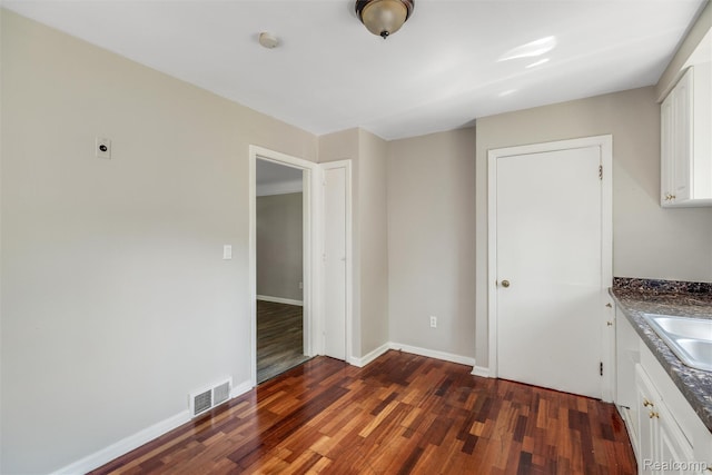 12892 Asbury Park, Detroit, MI 48227 - unfurnished dining area with wood finished floors and baseboards