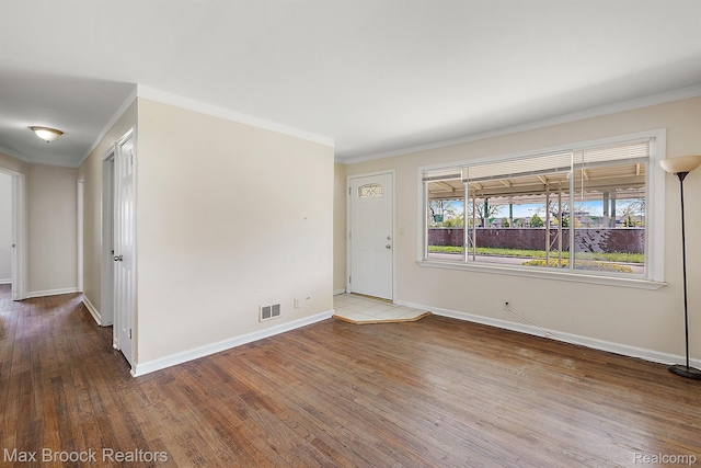 561 E Bennett Ave, Ferndale, MI 48220 - spare room with crown molding and hardwood / wood-style floors