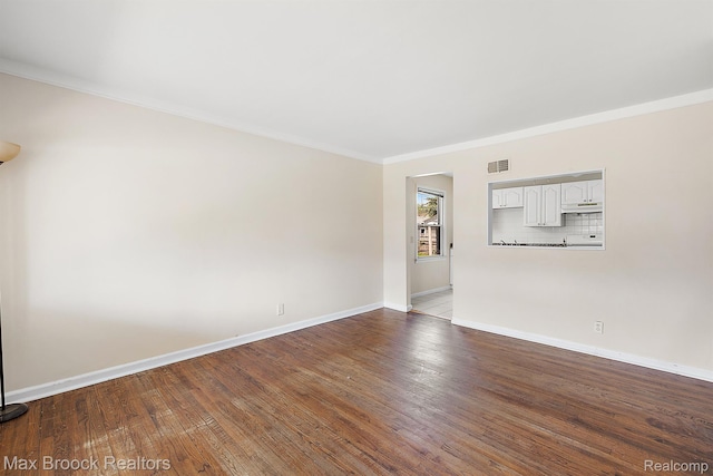 561 E Bennett Ave, Ferndale, MI 48220 - unfurnished room with ornamental molding and wood finished floors