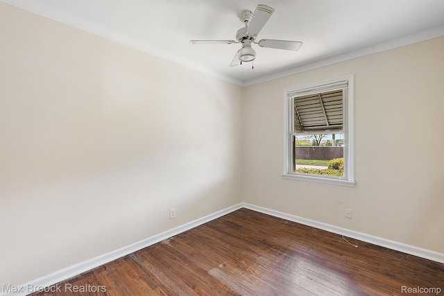 561 E Bennett Ave, Ferndale, MI 48220 - spare room featuring dark wood-style flooring, ornamental molding, and a ceiling fan