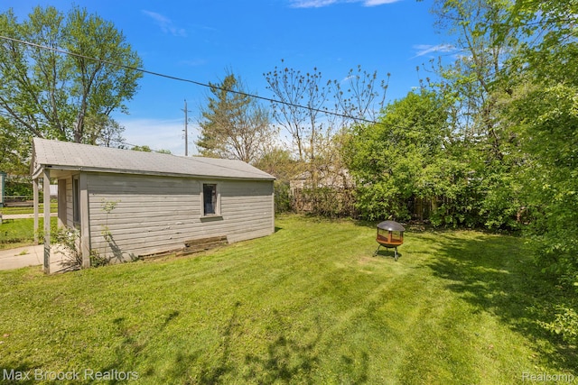 561 E Bennett Ave, Ferndale, MI 48220 - view of yard featuring an outdoor structure and an outdoor fire pit