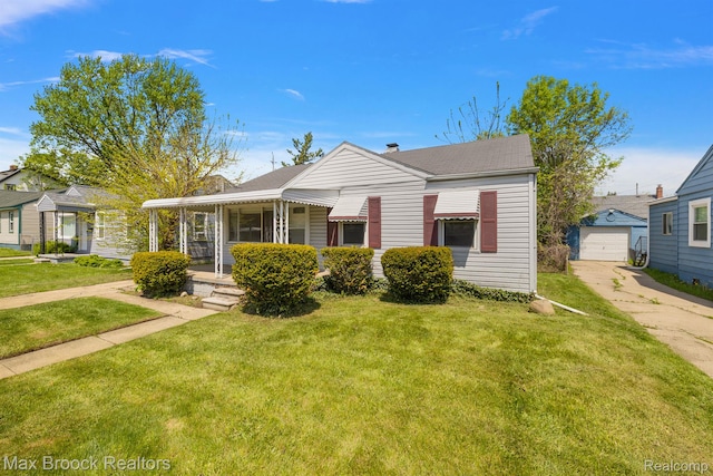 561 E Bennett Ave, Ferndale, MI 48220 - bungalow featuring driveway, an outdoor structure, a front yard, and a detached garage