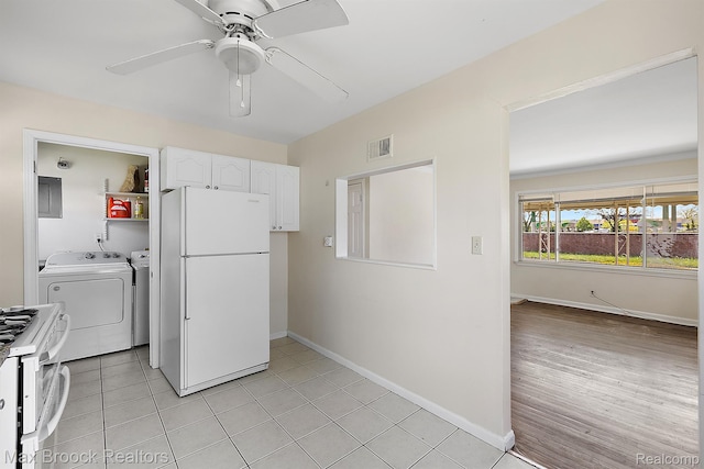 561 E Bennett Ave, Ferndale, MI 48220 - kitchen with white appliances, washing machine and dryer, white cabinets, ceiling fan, and light countertops