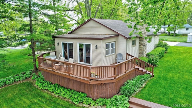 4030 Rollins Ave, Waterford, MI 48329 - back of house with a wooden deck, a yard, and roof with shingles