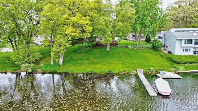 4030 Rollins Ave, Waterford, MI 48329 - dock area with a water view, a yard, and view of scattered trees