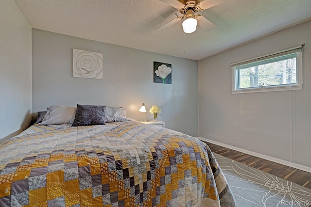 4030 Rollins Ave, Waterford, MI 48329 - bedroom with wood finished floors, a ceiling fan, and a textured ceiling