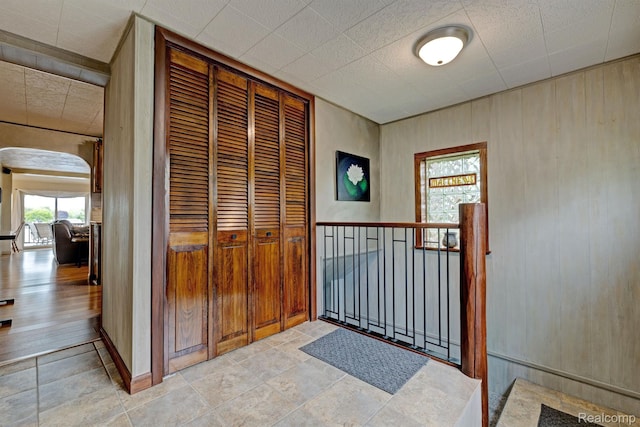 4030 Rollins Ave, Waterford, MI 48329 - hallway with arched walkways and wood walls