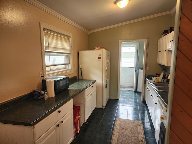 7965 Elm St, Taylor, MI 48180 - kitchen featuring freestanding refrigerator, ornamental molding, white cabinets, dark countertops, and dark tile patterned floors
