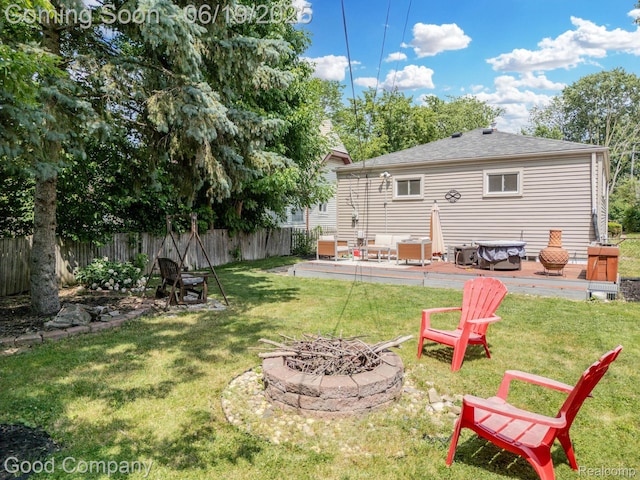 3979 Royal Ave, Berkley, MI 48072 - fenced backyard featuring an outdoor fire pit and a wooden deck