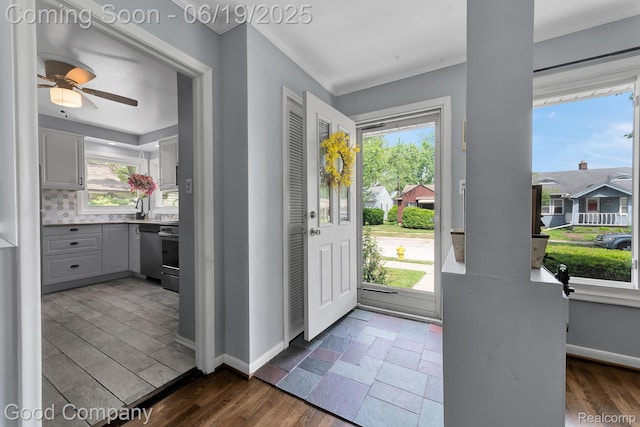 3979 Royal Ave, Berkley, MI 48072 - entrance foyer featuring crown molding, a ceiling fan, and dark wood finished floors