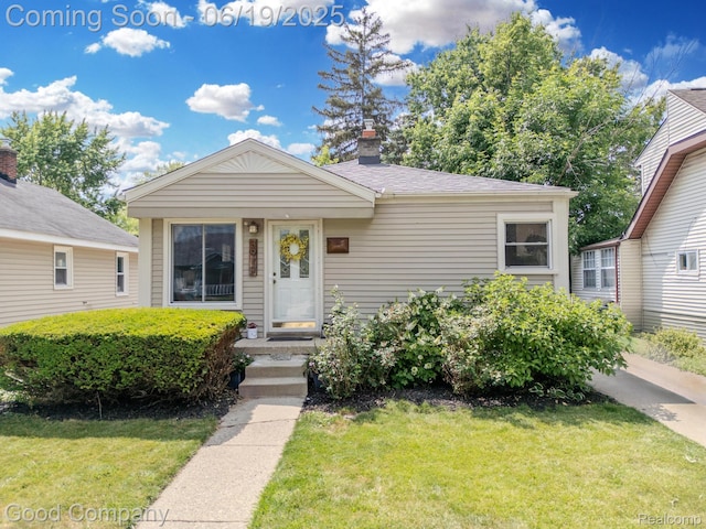 3979 Royal Ave, Berkley, MI 48072 - view of front facade featuring a front yard and a chimney