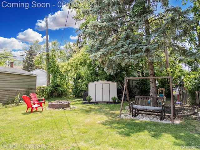 3979 Royal Ave, Berkley, MI 48072 - fenced backyard featuring an outdoor fire pit and a storage shed