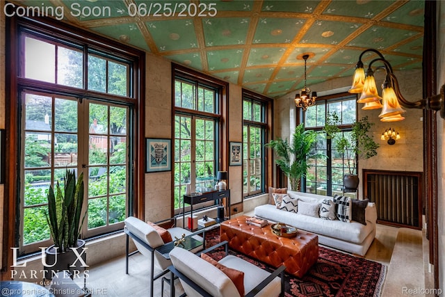 2150 Iroquois St, Detroit, MI 48201 - living area with a chandelier and wood finished floors