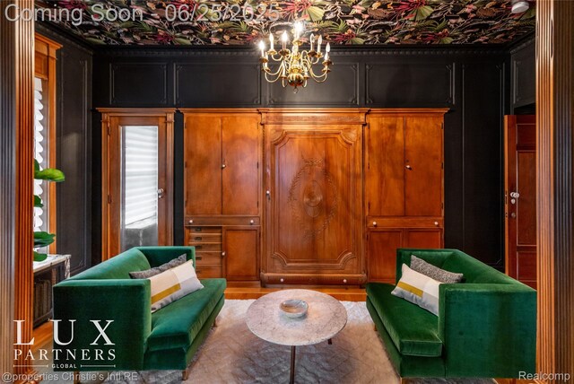 2150 Iroquois St, Detroit, MI 48201 - living area with a chandelier and light wood-type flooring