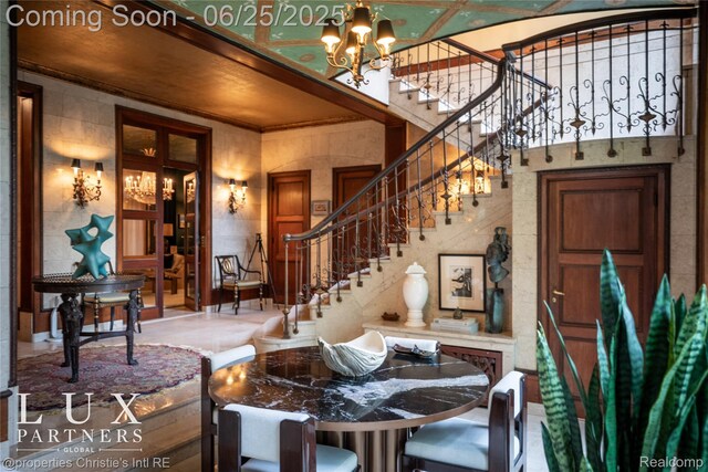 2150 Iroquois St, Detroit, MI 48201 - dining room with a chandelier, stairway, and ornamental molding