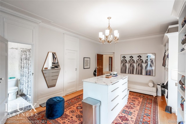 2150 Iroquois St, Detroit, MI 48201 - spacious closet featuring a chandelier and light wood-style flooring