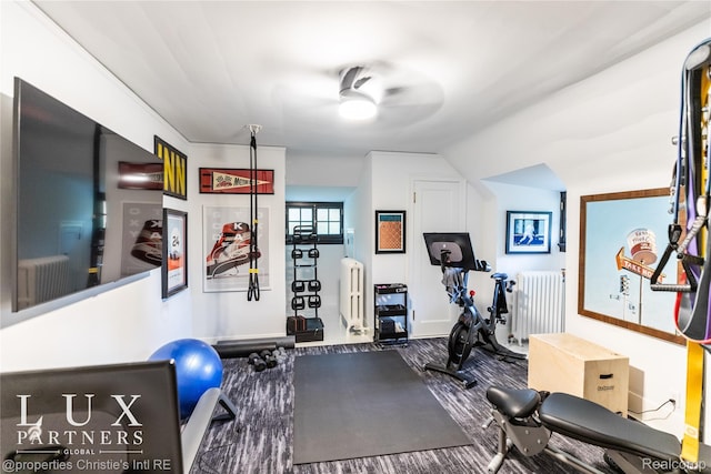 2150 Iroquois St, Detroit, MI 48201 - exercise area featuring radiator heating unit, a ceiling fan, and vaulted ceiling