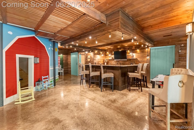 23736 Point O Woods Ct, South Lyon, MI 48178 - kitchen featuring wooden walls, concrete flooring, and a wooden ceiling with exposed beams