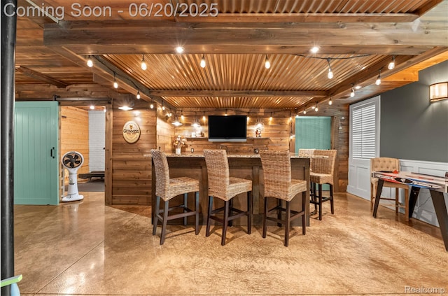 23736 Point O Woods Ct, South Lyon, MI 48178 - indoor bar with wood walls, finished concrete flooring, a wooden ceiling with exposed beams, and track lighting