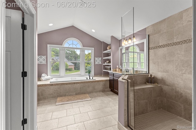23736 Point O Woods Ct, South Lyon, MI 48178 - full bathroom with a garden tub, vaulted ceiling, a shower stall, vanity, and tile patterned flooring