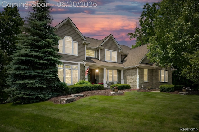 23736 Point O Woods Ct, South Lyon, MI 48178 - view of front of house with a lawn and a shingled roof