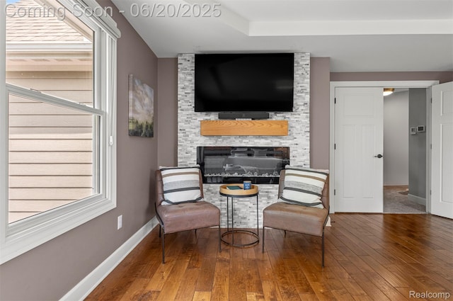 23736 Point O Woods Ct, South Lyon, MI 48178 - living area featuring a fireplace, hardwood / wood-style floors, and plenty of natural light
