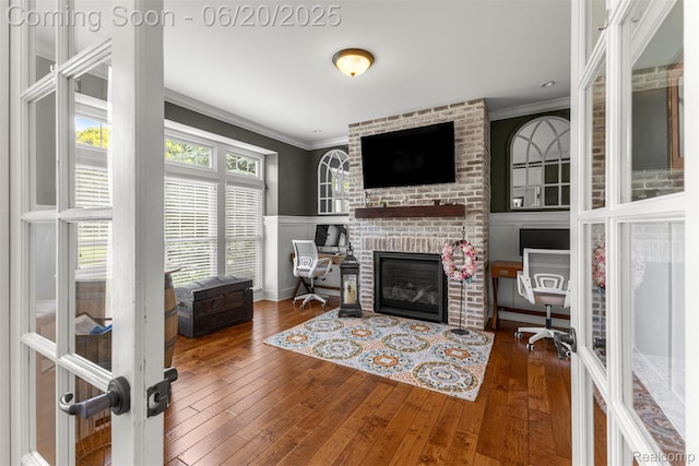 23736 Point O Woods Ct, South Lyon, MI 48178 - living area with ornamental molding, a fireplace, hardwood / wood-style flooring, and an office area