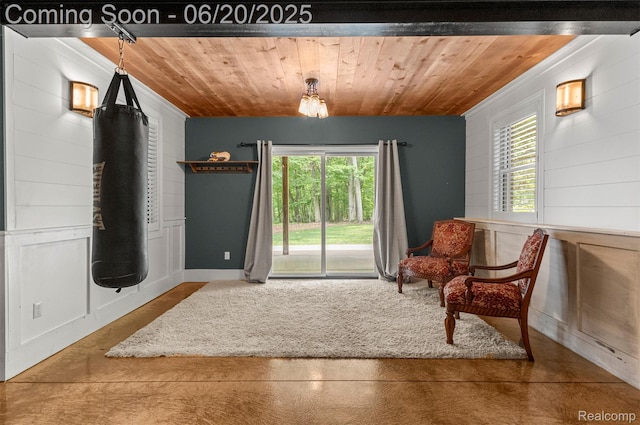 23736 Point O Woods Ct, South Lyon, MI 48178 - sitting room with wooden ceiling, finished concrete flooring, and crown molding