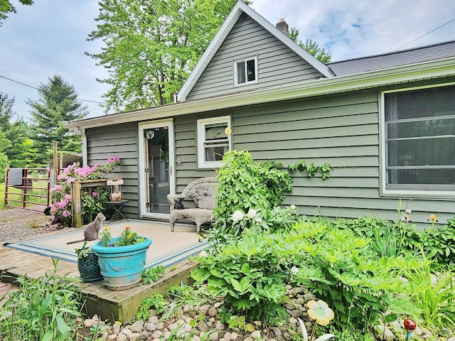 350 S Catalpa Ave, White Cloud, MI 49349 - rear view of property featuring a chimney and a deck